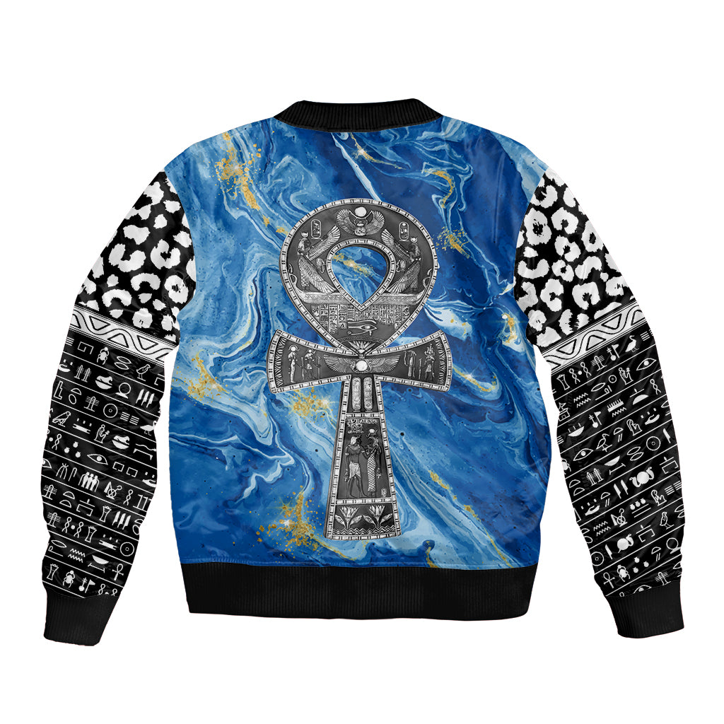 Blue bomber jacket with ankh emblem on back, ribbed collar, and black-and-white sleeves