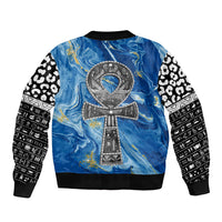 Blue bomber jacket with ankh emblem on back, ribbed collar, and black-and-white sleeves