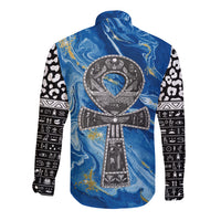 Long-sleeve shirt with blue ankh emblem on back and black-and-white icon print sleeves