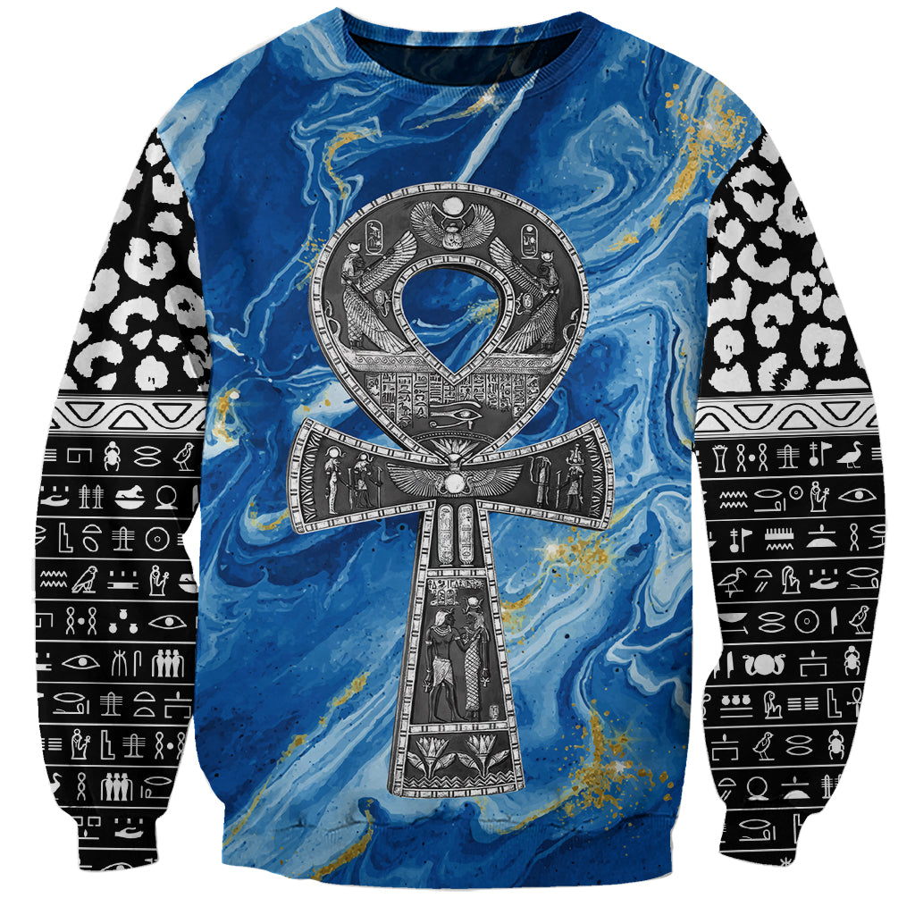 Unisex blue crewneck sweatshirt with large cross/ankh print and leopard-pattern sleeves