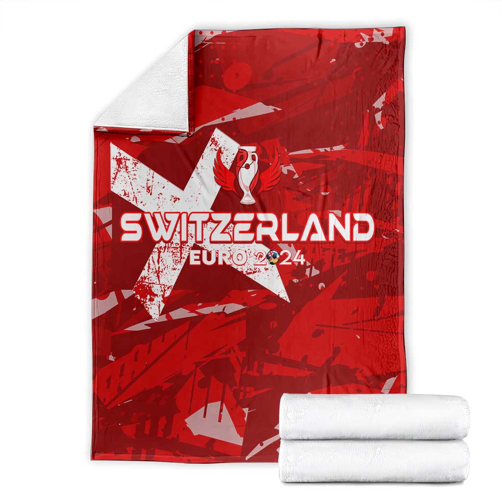 Red Switzerland football blanket with star graphic and “EURO 2024” text, folded with towels