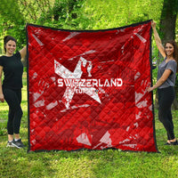 Red quilt blanket with Switzerland Euro 2024 star design, spread outdoors