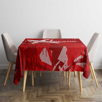 Red printed tablecloth on dining table with scattered wing-and-star design
