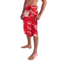 Red personalized sarong wrap skirt with white feather pattern and “YOUR NAME 00”