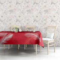 Red feather-printed tablecloth with Austria 2024 logo on front edge of table