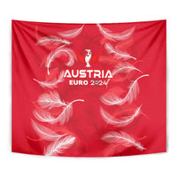 Red hanging tapestry with white feathers and Austria Euro 2024 emblem, centered