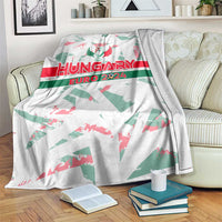 White Hungary Euro 2024 blanket draped over sofa, crest and red/green text