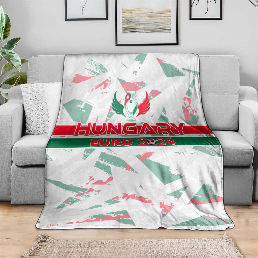 White Hungary Euro 2024 blanket on gray sofa, crest and red "HUNGARY" text