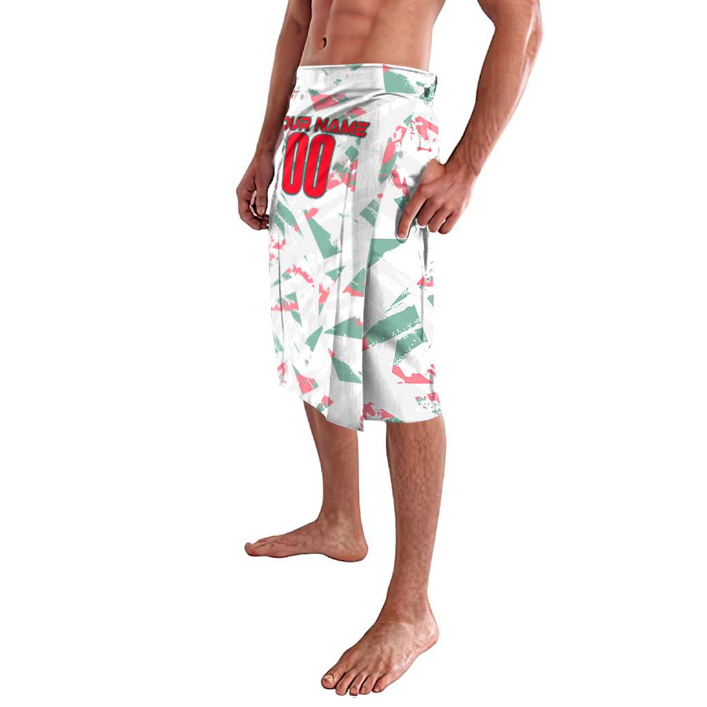 Personalized football graphic shorts in white with green and red geometric print, side view