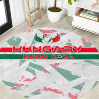 Round rug close-up showing Hungary Euro 2024 logo and red/green stripes on gray.