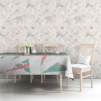 White tablecloth with green and red bird-like graphic and Hungary 2024 border