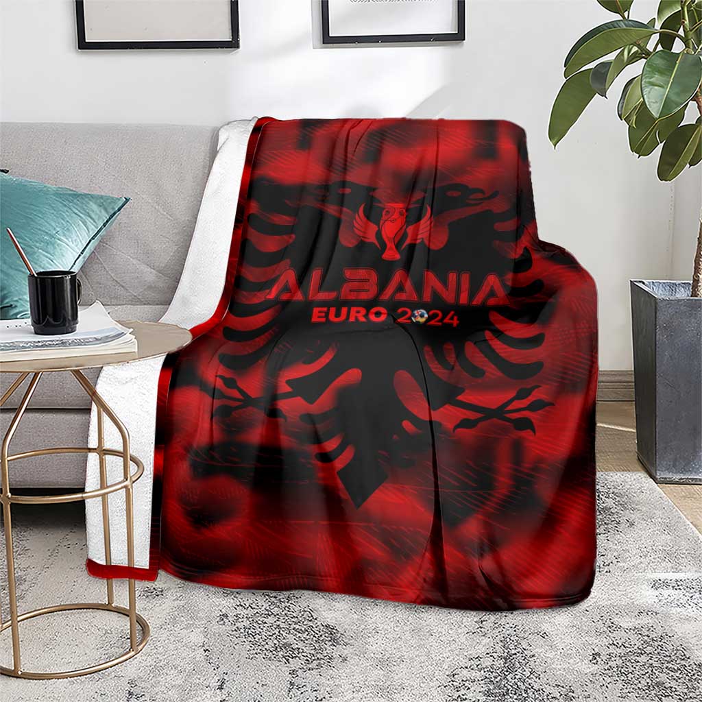Red and black Albania football blanket on floor with eagle crest and EURO 2024