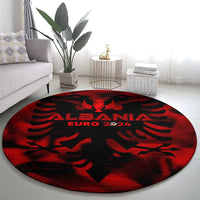 Red and black round carpet with winged emblem and ALBANIA EURO 2024