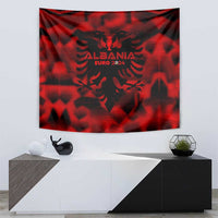 Red wall tapestry with black Albania emblem and text "EURO 2024"