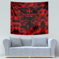 Red hanging tapestry with black Albanian eagle crest and "EURO 2024"