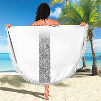 White circular beach blanket with fringe, SLOVENIA EURO 2024 logo held like a cape