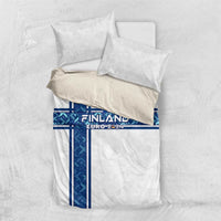 Folded white bedding set with two pillows showing blue Finland EURO 2024 cross stripe