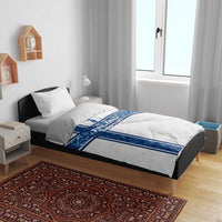 White duvet cover with blue Finland EURO 2024 cross stripe design and matching pillows