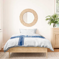 White duvet cover with blue Finland EURO 2024 cross stripe graphic, with pillows