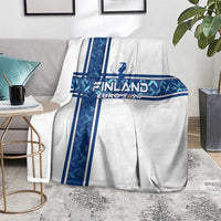 White blanket on floor with blue Finland cross and Euro 2024 graphic