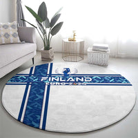 Round rug featuring Finland Euro 2024 emblem with blue pattern bands on light fabric
