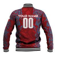 Red baseball jacket back with blue geometric graphics, personalized name and number, ribbed hem