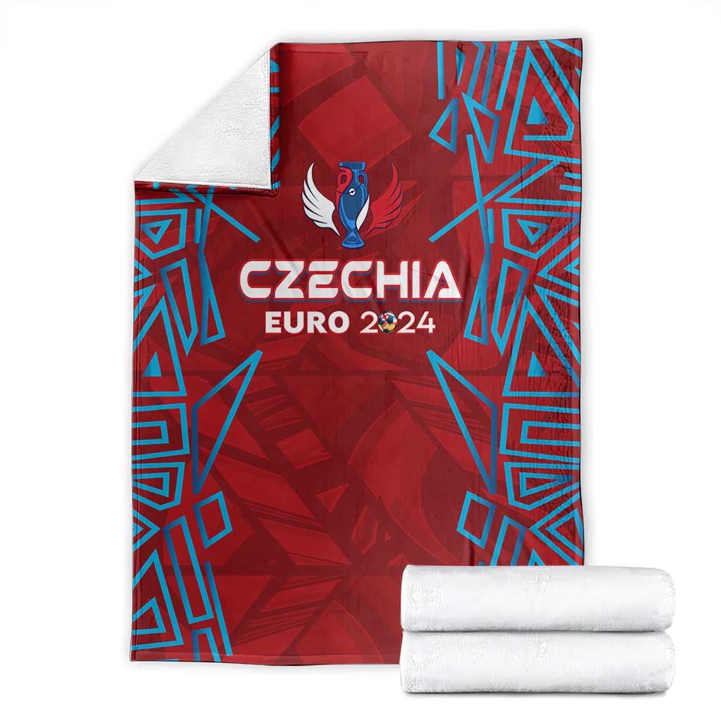 Folded red Czechia Euro 2024 blanket with blue geometric pattern, bird logo, and text