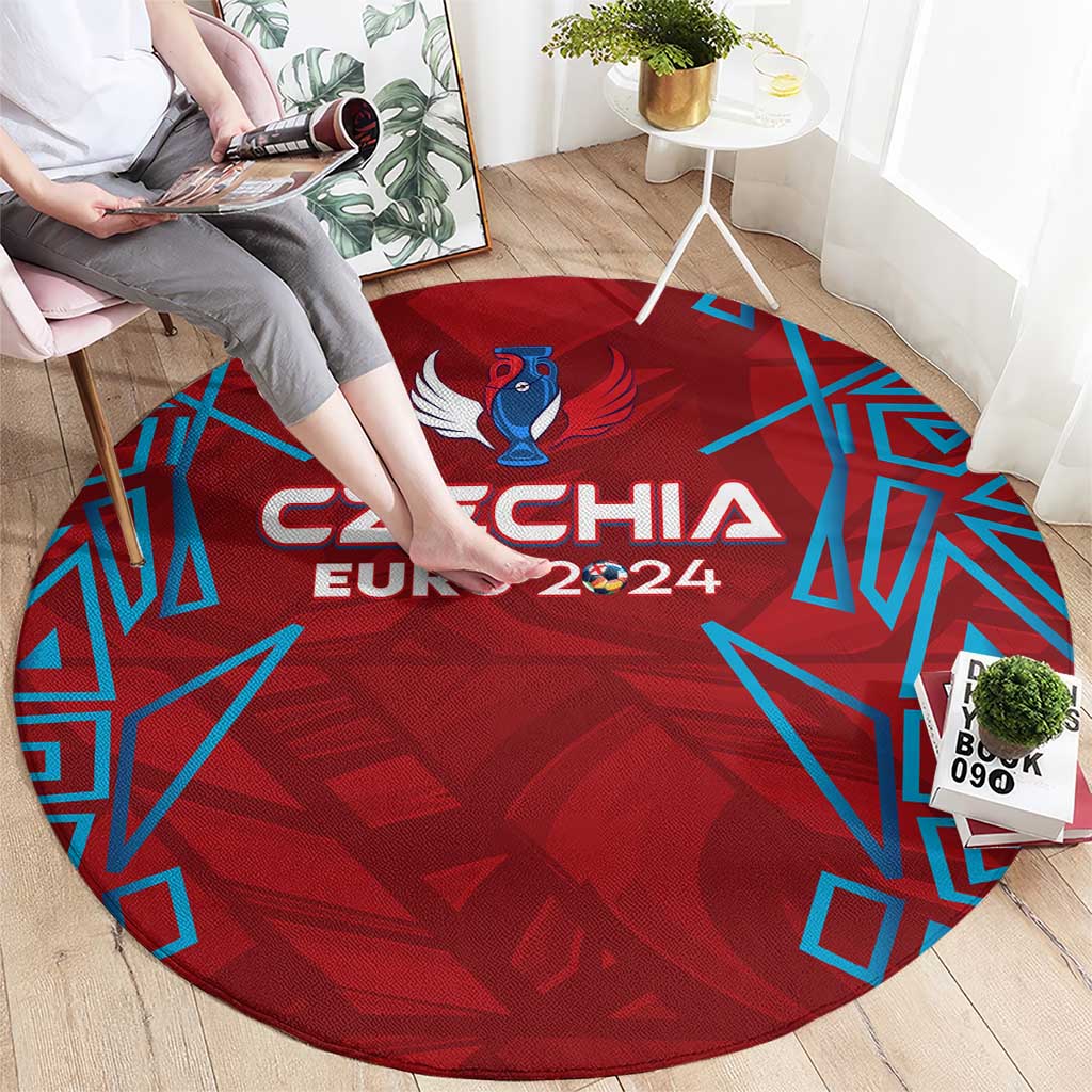 Red round rug with central Czechia Euro 2024 mascot graphic and blue pattern