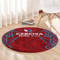 Red round rug with Czechia Euro 2024 lettering and blue geometric accents