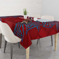 Red tablecloth with blue geometric lines and graphic motif over dining table