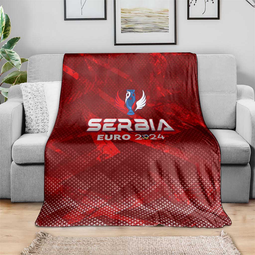 Red Serbia Euro 2024 trophy wing style blanket draped over gray sofa
