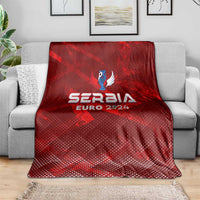 Red Serbia Euro 2024 trophy wing style blanket draped over gray sofa