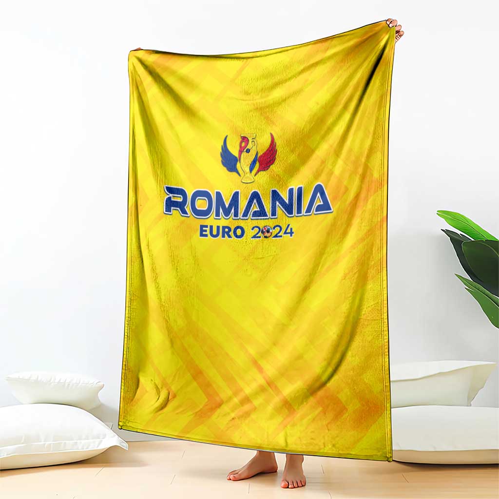 Yellow football blanket featuring Romania Euro 2024 logo and wing emblem, draped down