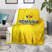 Yellow Romania Euro 2024 football blanket with wing emblem, covering sofa seat