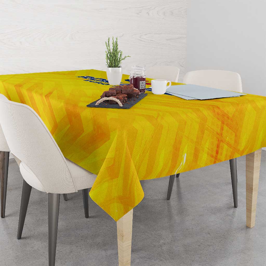 Yellow football tablecloth on dining table with logo centered over the tabletop