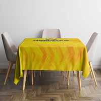 Yellow football tablecloth covering round dining table, Romania crest logo at top