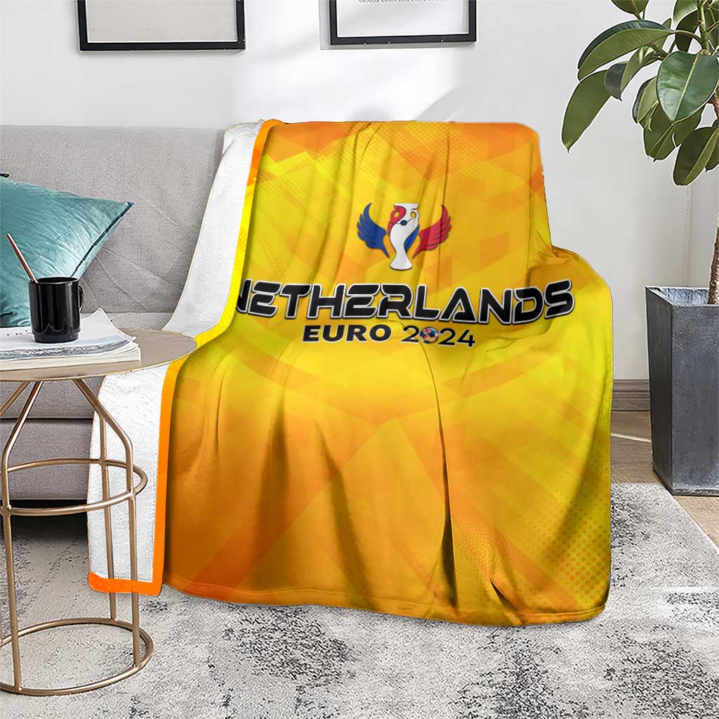 Yellow Netherlands Euro 2024 blanket with trophy wing print on living room couch