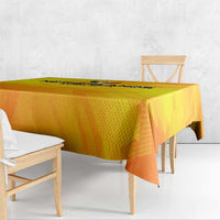 Yellow and orange football tablecloth with patterned finish on wooden table