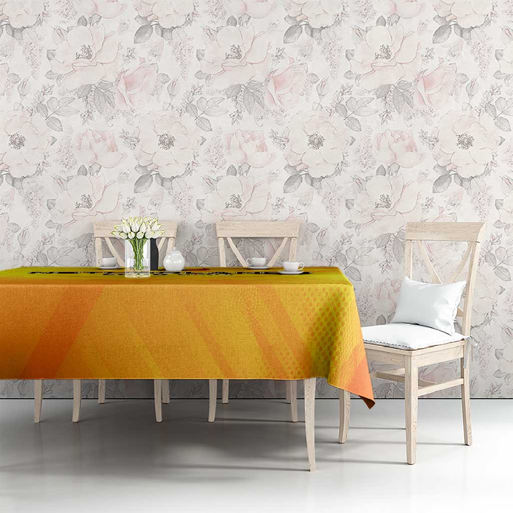 Yellow football tablecloth on long table with Netherlands crest beside chairs