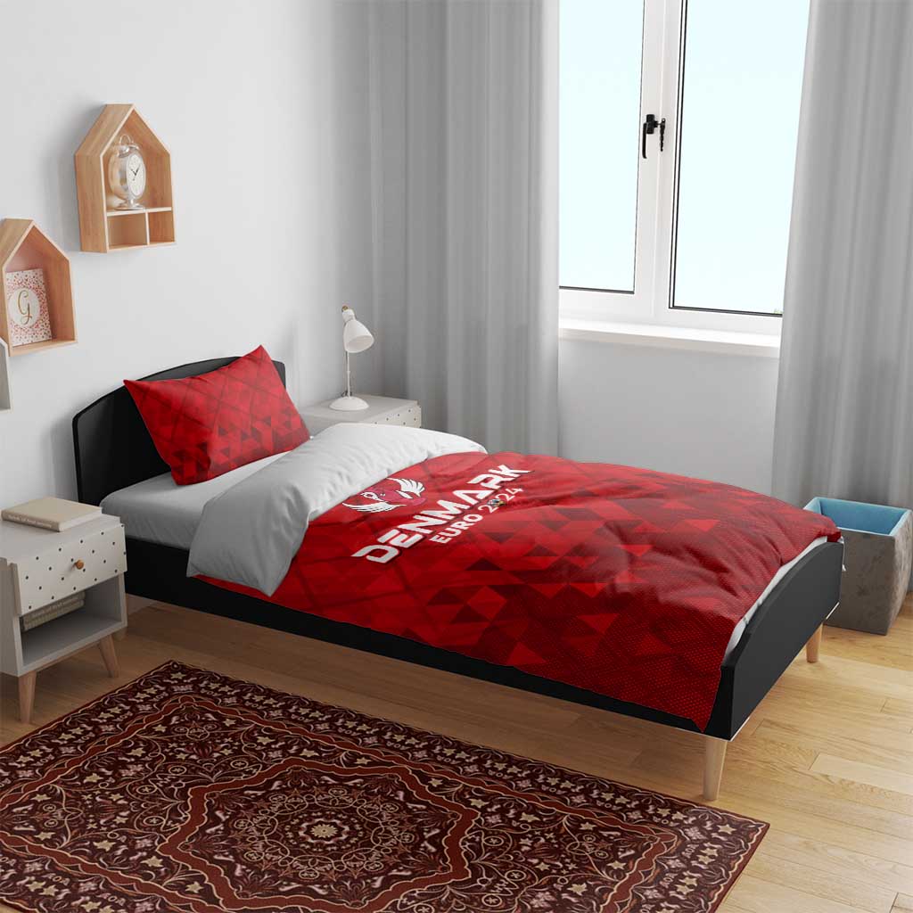 Red Denmark Euro 2024 bedding set on a bed with duvet and two pillowcases