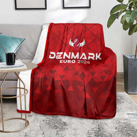 Red Denmark football blanket on floor with Denmark EURO 2024 branding