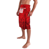 Red personalized lavalava skirt with geometric pattern, elastic waist, white 'YOUR NAME 00'.