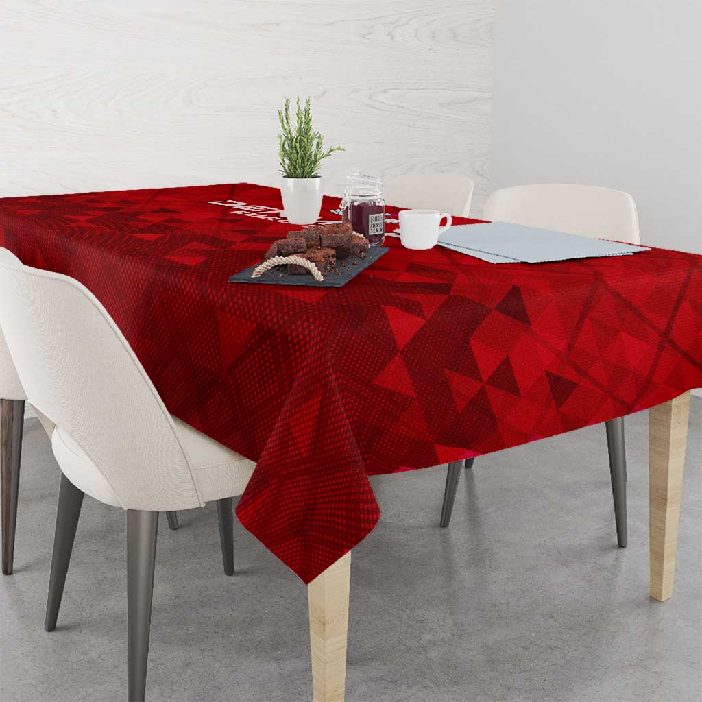 Red football themed tablecloth with repeating triangle pattern on dining table