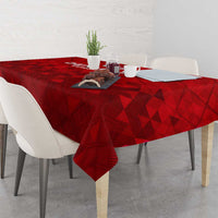 Red football themed tablecloth with repeating triangle pattern on dining table