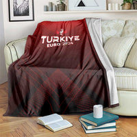 Red football blanket draped on sofa, with trophy crest and TURKIYE EURO 2024 print