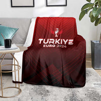 Red football blanket on seat cushion, with trophy crest and TURKIYE EURO 2024 branding