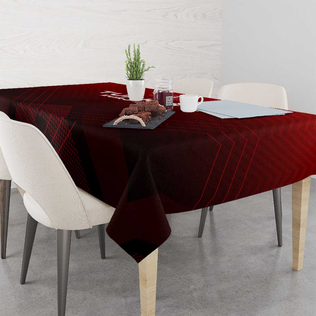 Red tablecloth covering square table, winged trophy logo centered