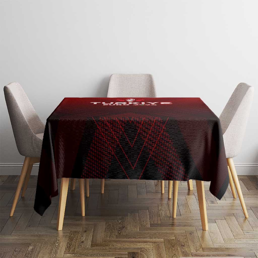 Red rectangular tablecloth with winged trophy logo and dark geometric pattern
