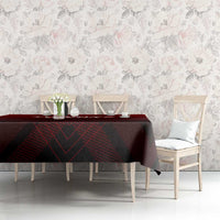 Red tablecloth on long table featuring trophy wing emblem with geometric pattern