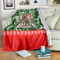 Green tropical Christmas blanket with Santa character, white palm prints, and red scalloped ornament band